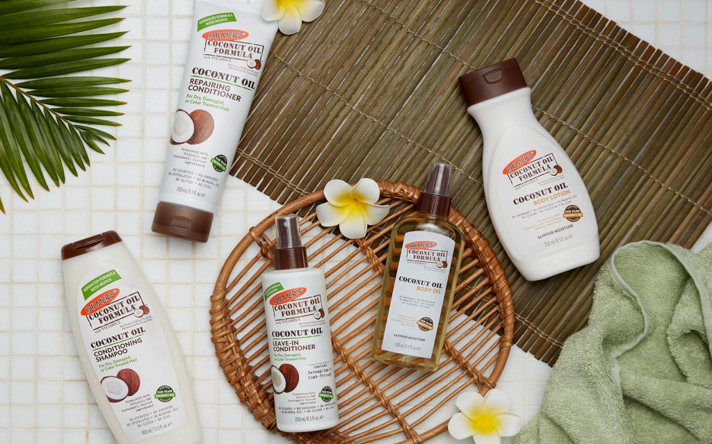Palmer’s Coconut Oil bath products arranged with tropical spa accents.