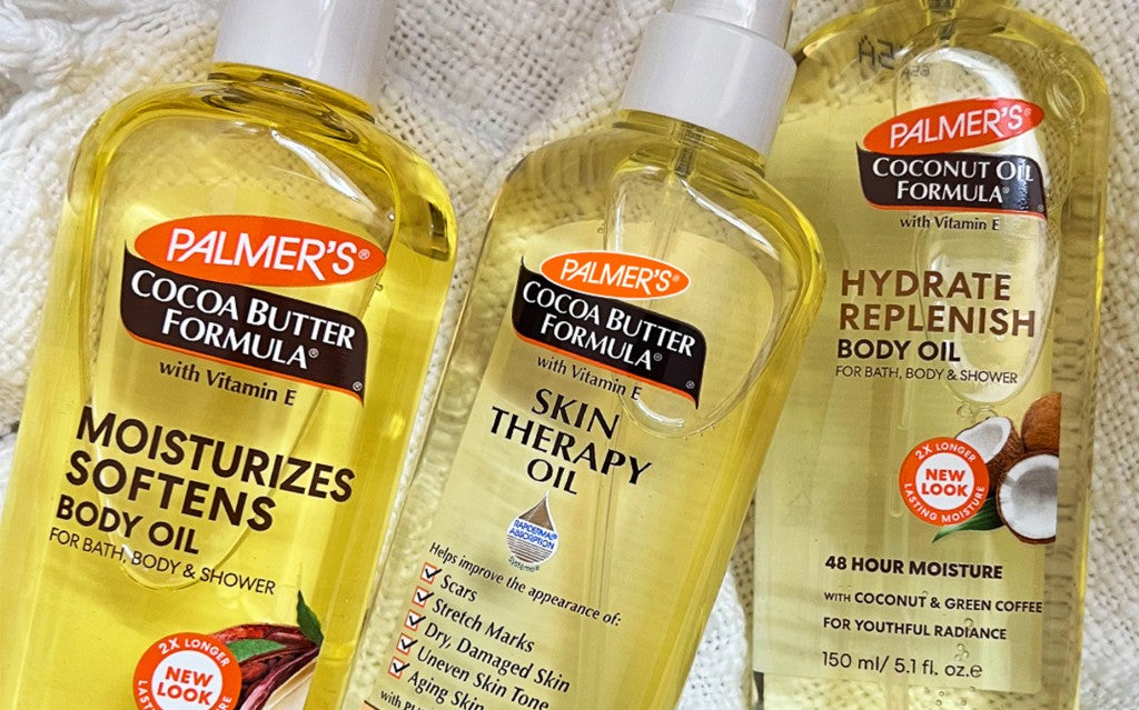 Close-up of the best body oils for glowing skin, Palmer's Body Oils, on a table