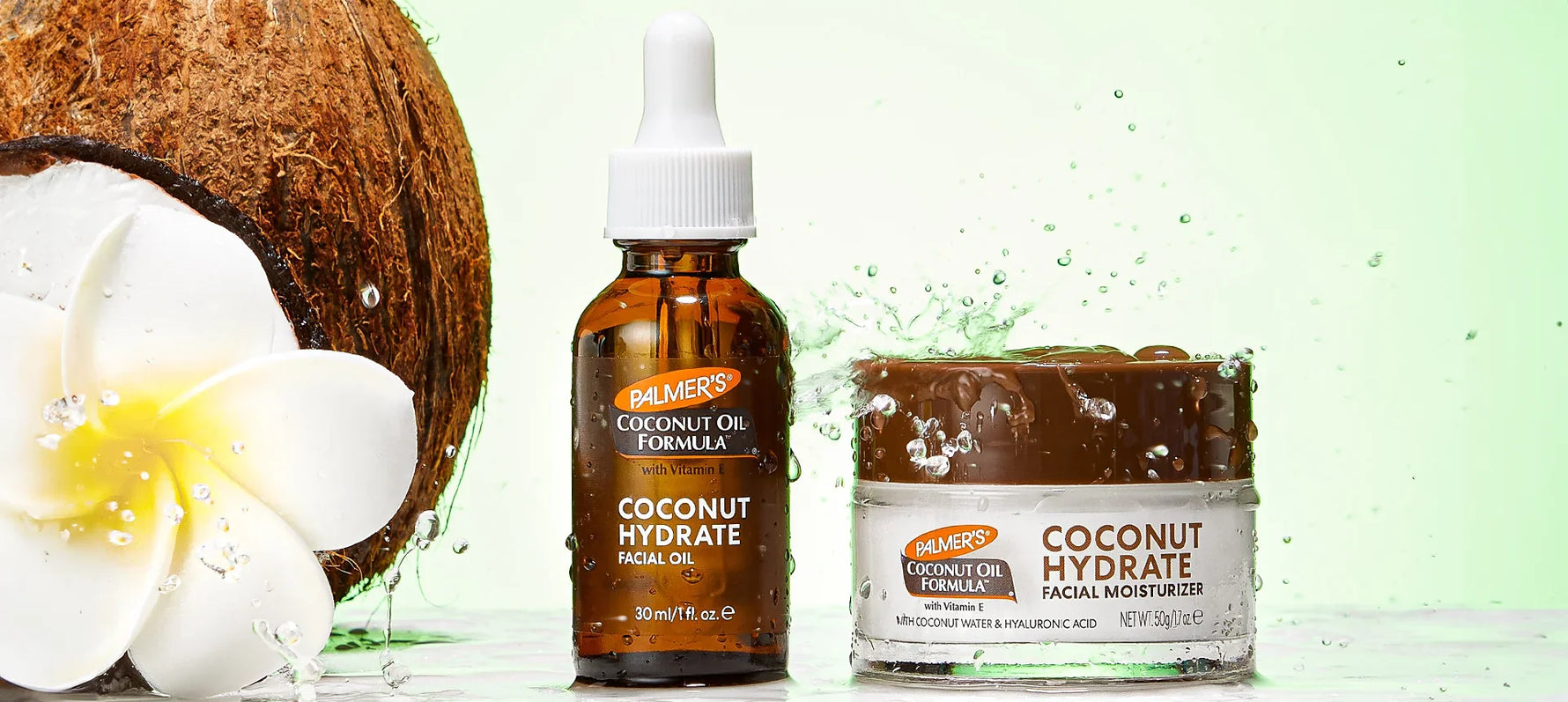 Palmer's Coconut Hydrate Facial Oil and Moisturizer under water splash next to coconut and monoi flower