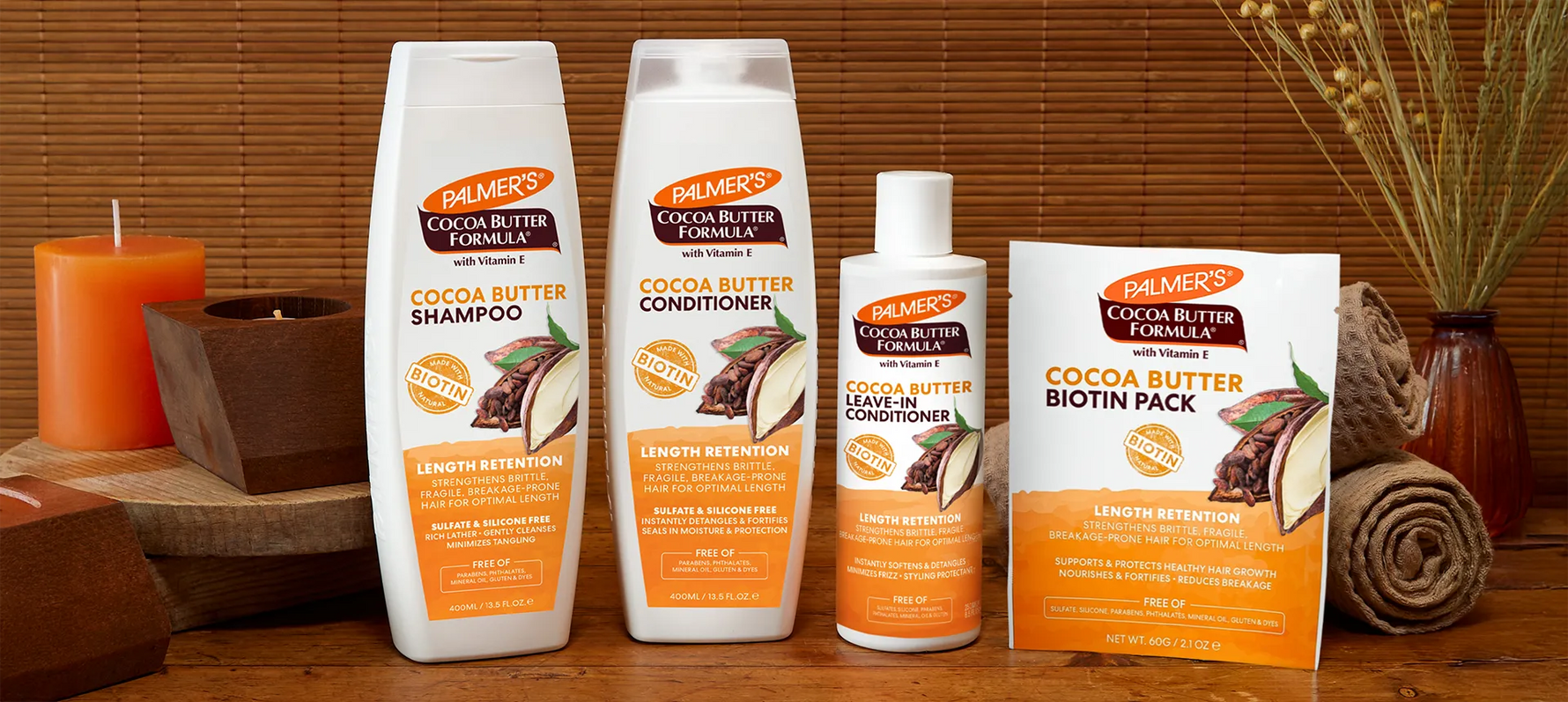 Palmer's Cocoa Butter Hair collection on wooden table in spa setting