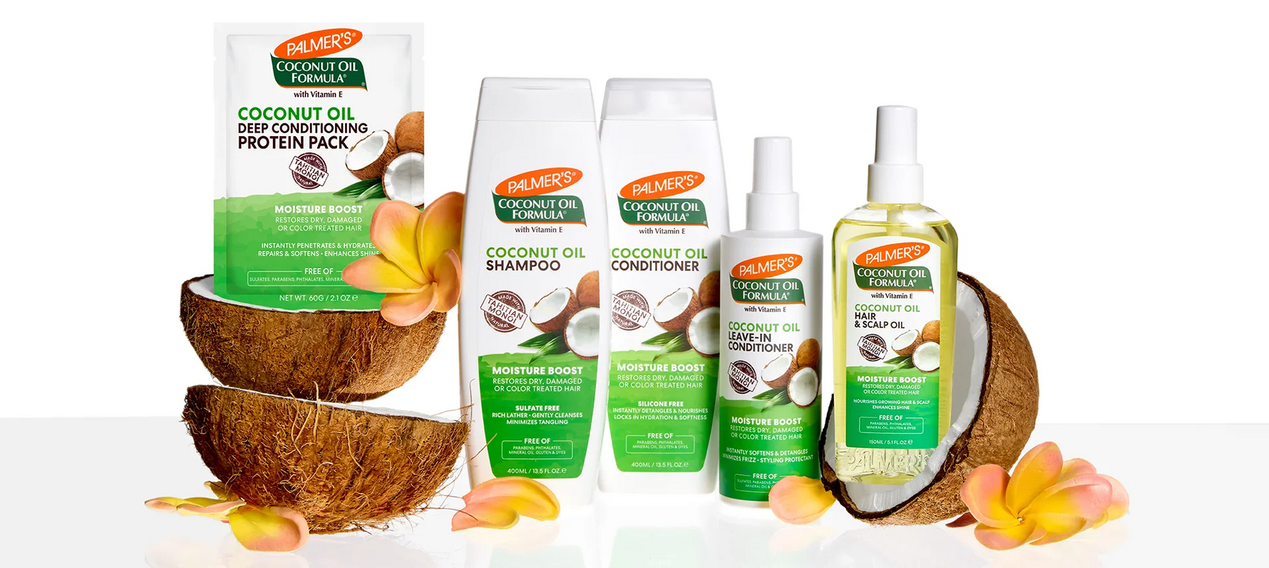 Palmer's Coconut Oil hair care with coconuts and flowers on white background