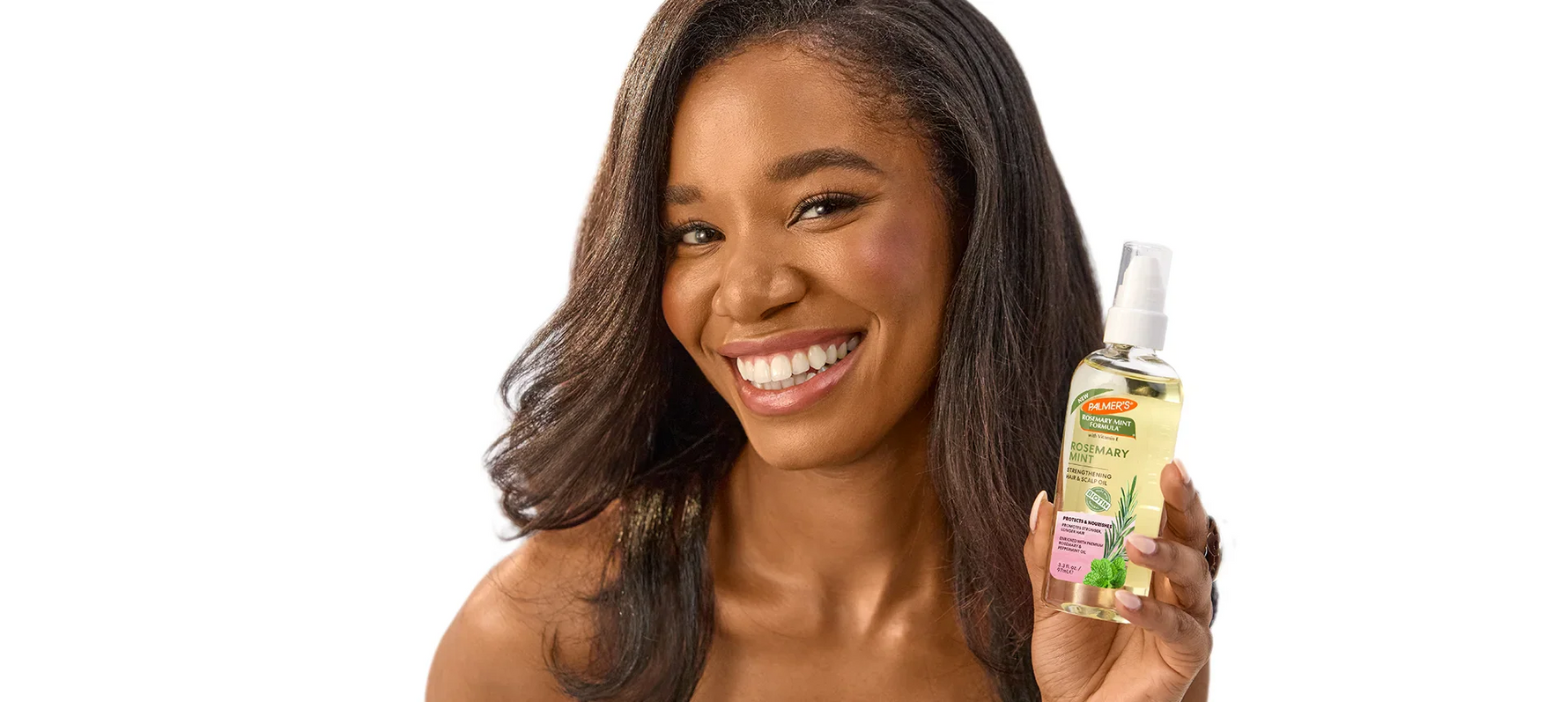 Woman holding Palmer's Rosemary Mint Hair & Scalp Oil