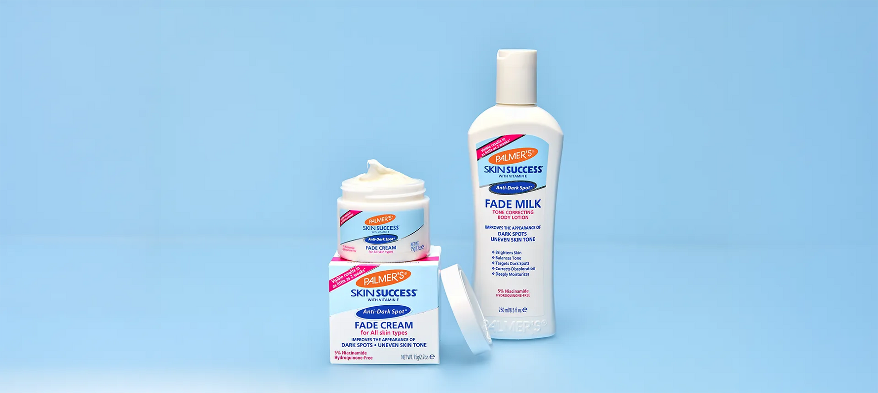 Palmer's Skin Success Fade Milk and Fade Cream on blue background