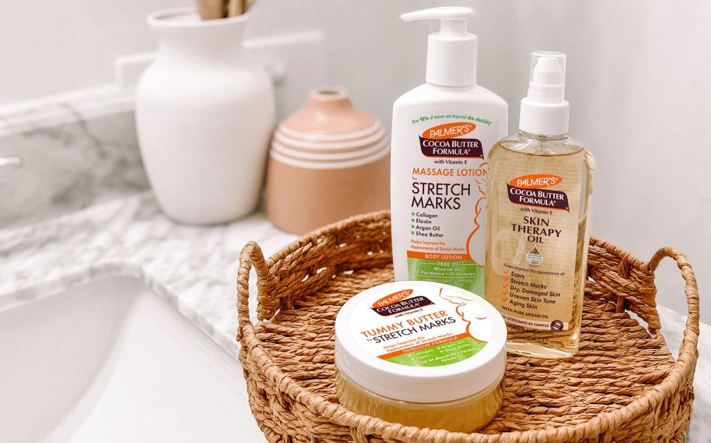 Palmer's Stretch Marks after pregnancy products in a woven tray on bathroom vanity