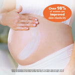 Pregnant belly with Massage Oil for Stretch Marks application.