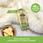 Massage Oil for Stretch Marks on faux-fur with cocoa butter chunks.