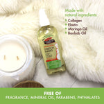 Massage Oil for Stretch Marks with natural ingredients on faux-fur background.