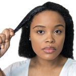 Young person showcasing Moisture Boost Deep Conditioner effects on curly hair.