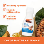 Daily Skin Therapy Cocoa Butter Body Lotion with Vitamin E, surrounded by cocoa beans and Vitamin E capsules.