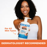 Woman holding Palmer's Daily Skin Therapy Cocoa Butter Body Lotion.