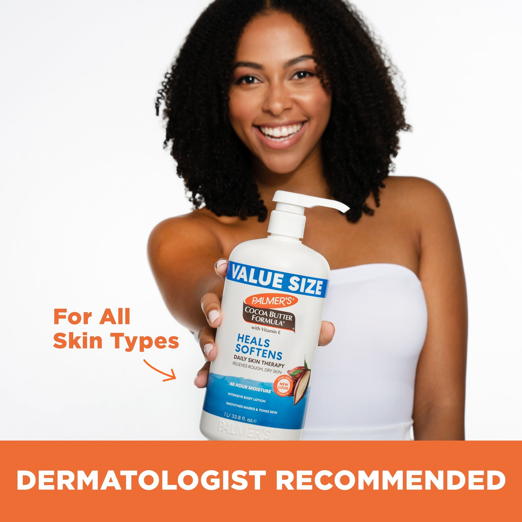 Woman holding Palmer's Daily Skin Therapy Cocoa Butter Body Lotion.