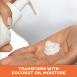 Person dispensing Coconut Hydrate Body Lotion into their palm.