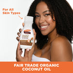Woman holding Palmer’s Coconut Hydrate Body Lotion with coconut oil.