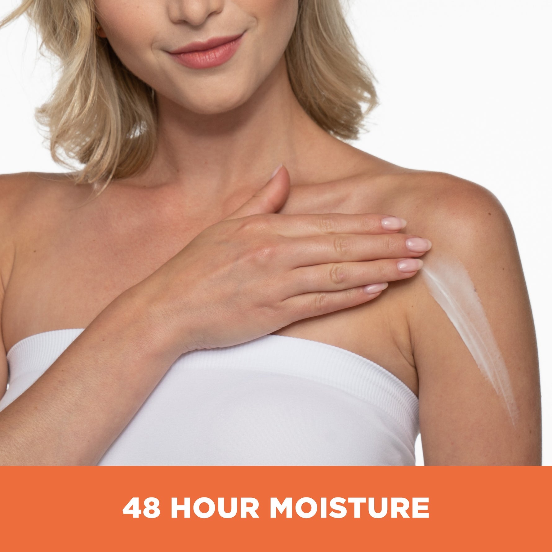 Woman applying Raw Shea Nourish Body Lotion to shoulder.