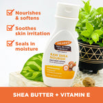 Raw Shea Nourish Body Lotion with Vitamin E, surrounded by shea nuts.
