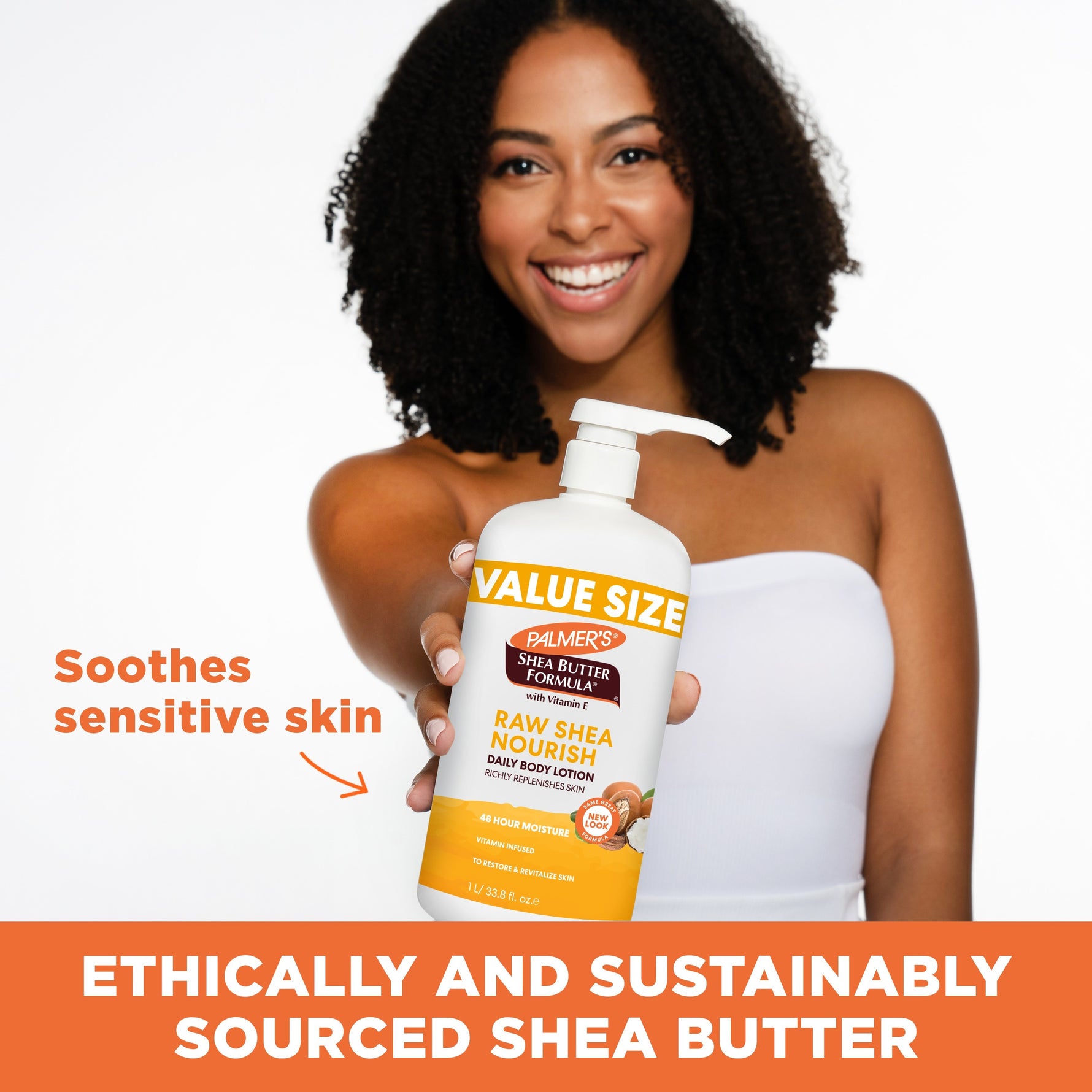 Model with Palmer's Raw Shea Nourish Body Lotion, soothing sensitive skin.