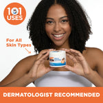Woman holding Palmer's Cocoa Butter Formula Original Solid Jar, smiling.