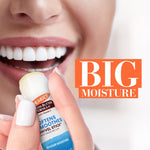 Smiling mouth holding Palmer’s Swivel Stick lip balm.