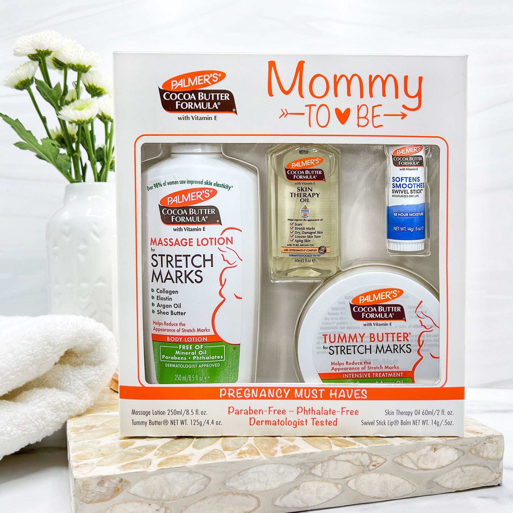 Mommy-To-Be Kit with four pregnancy skincare essentials displayed.