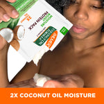 Dispensing Palmer’s Coconut Oil Protein Pack for moisture boost treatment.