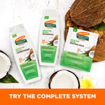 Palmer’s Coconut Oil Protein Pack with shampoo and conditioner, surrounded by coconuts.