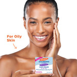 Woman with glowing skin holds Palmer’s Anti-Dark Spot Fade Cream.