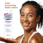 Woman holding Palmer’s Skin Success Anti-Dark Spot Fade Milk.