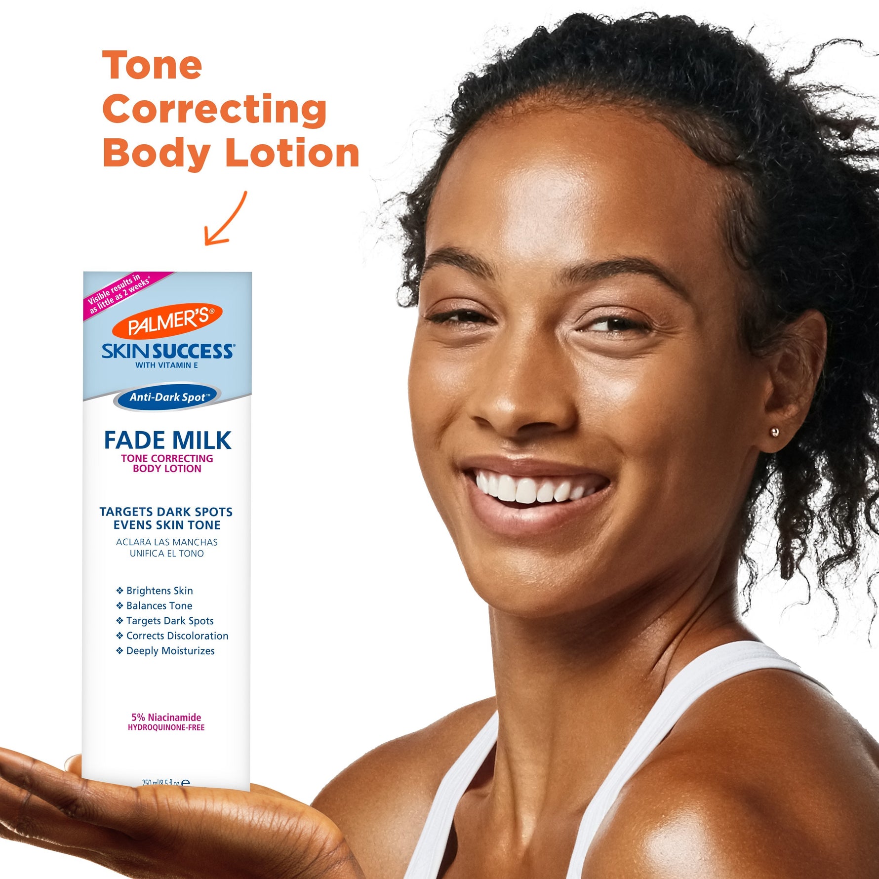 Woman holding Palmer’s Skin Success Anti-Dark Spot Fade Milk.