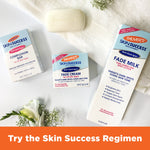 Palmer's anti-dark-spot Skin Success regimen products arranged with decorative flowers.