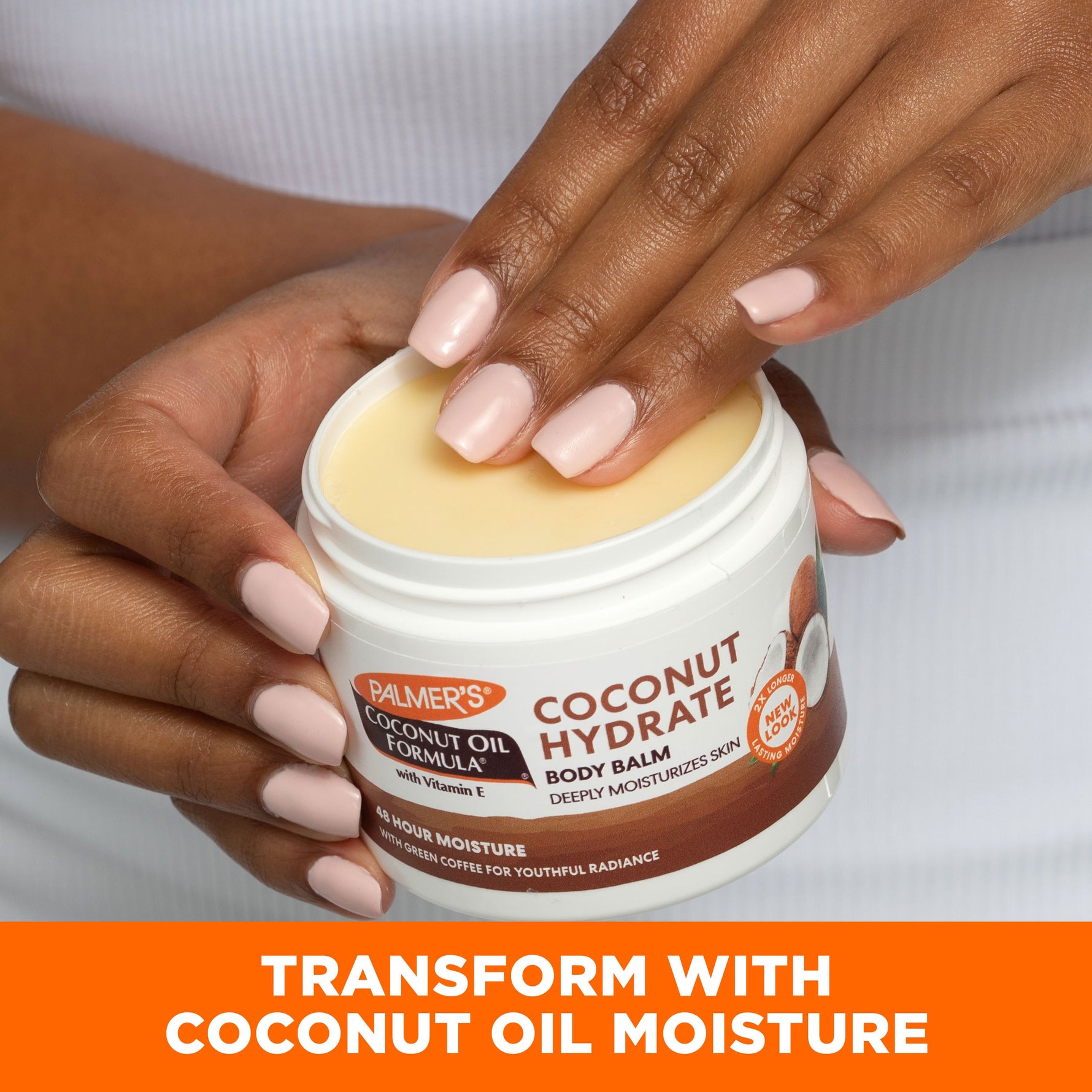 Hand dipping into Palmer's Coconut Hydrate Body Balm jar.
