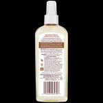 Back of Coconut Hydrate Body Oil bottle, highlighting fair trade coconut oil.