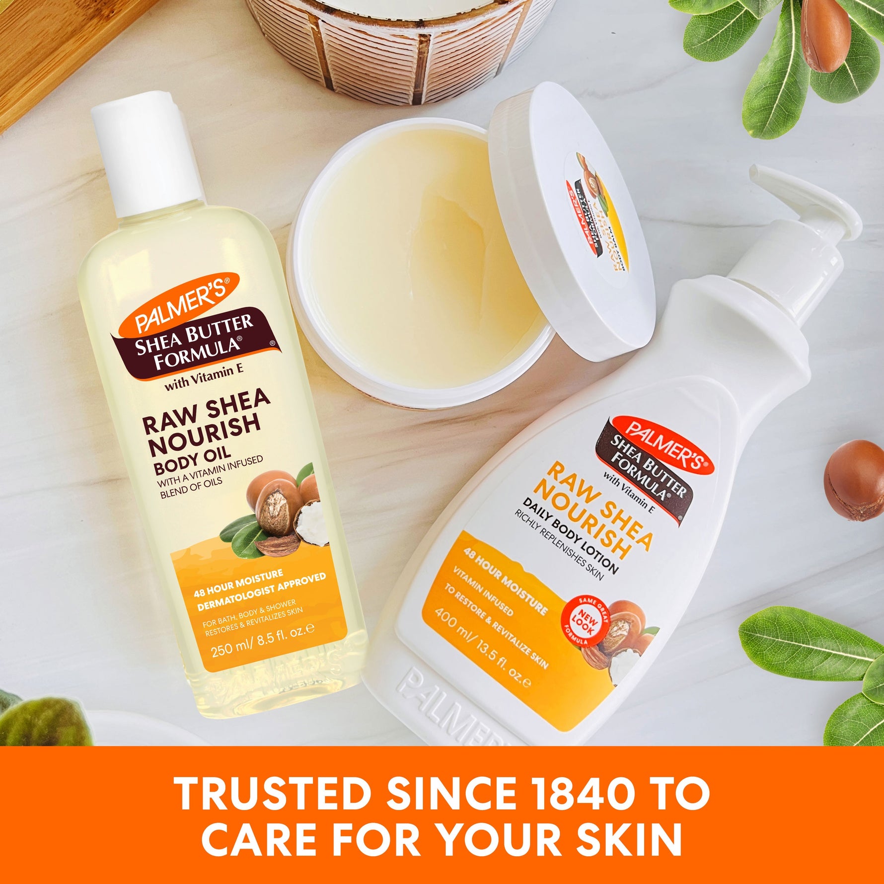 Raw Shea Nourish Body Oil with shea nuts and leaves displayed.