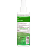 Back view of a green bottle with text and a barcode on a white background