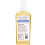 Back of bottle of Palmer's Cocoa Butter Formula Tahitian Vanilla Hair & Scalp Oil with label on a white background