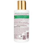 Back label of a hair care product with gold cap on a white background