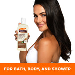 Woman holds Palmer's Coconut Hydrate Body Oil, highlighting 48-hour moisture.