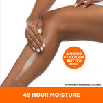 Woman applying Daily Skin Therapy Cocoa Butter Body Lotion.