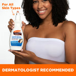 Woman holding Palmer's Daily Skin Therapy Cocoa Butter Body Lotion.