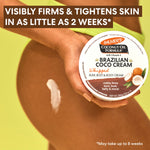 Model applying Palmer’s Brazilian Coco Whipped Bum, Bust & Body Cream.