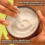 Brazilian Coco Whipped Bum, Bust & Body Cream in hand.