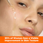Applying Skin Therapy Face Oil with a dropper on cheek.