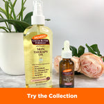 Skin Therapy Face Oil bottles with roses and plant backdrop.