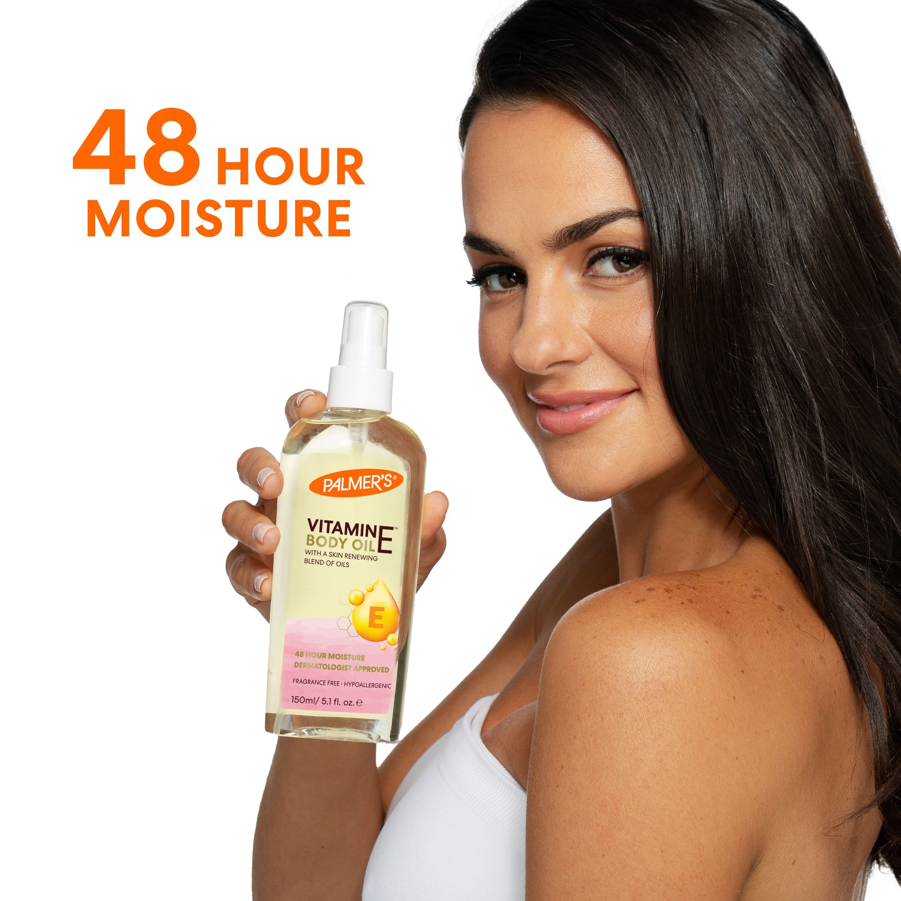 Woman holding Palmer’s Vitamin E Body Oil, 48-hour moisture.