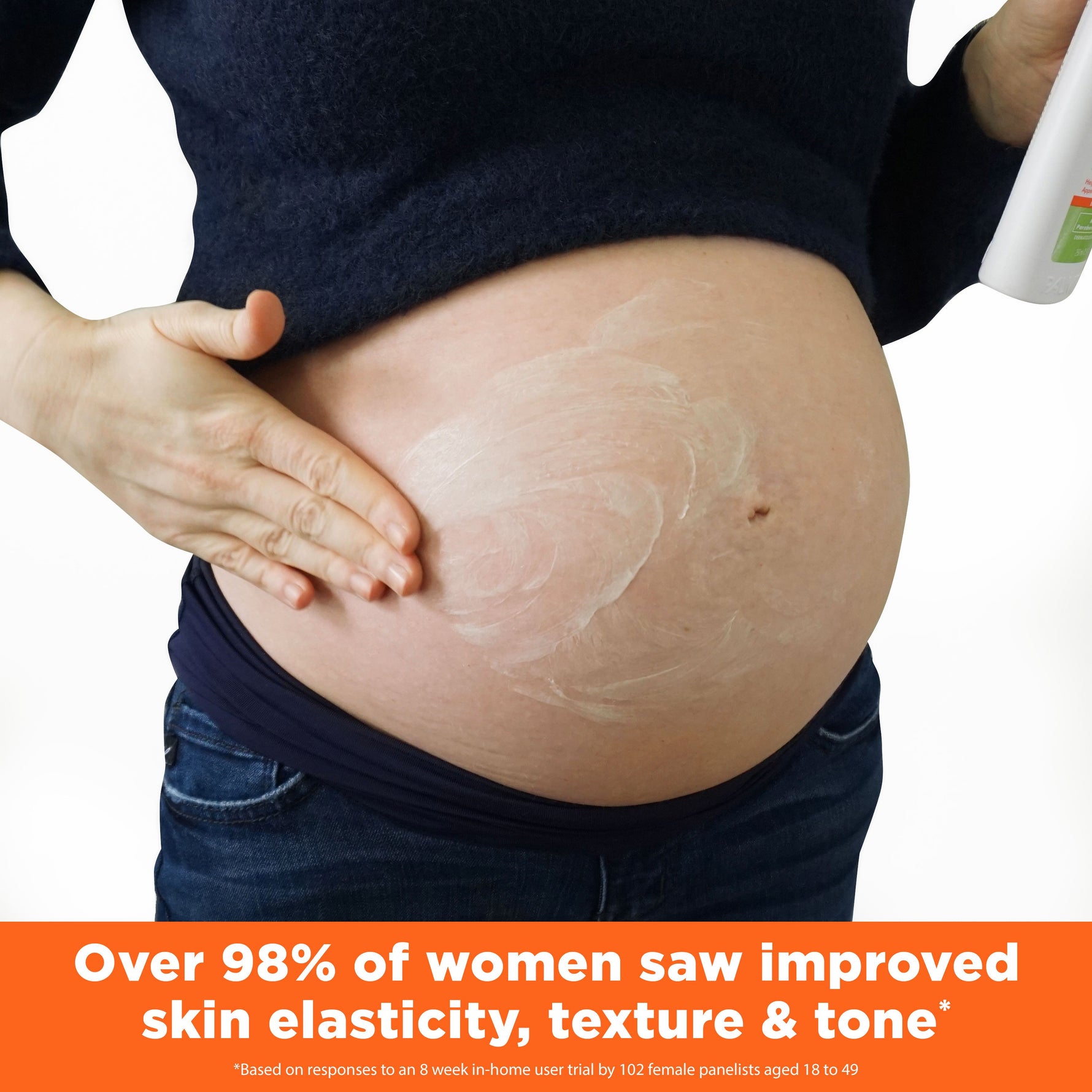 Pregnant woman applying Cocoa Butter Massage Lotion for Stretch Marks.