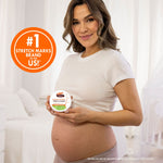 Pregnant woman holding Palmer's Cocoa Butter Tummy Butter jar.
