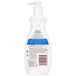 White bottle with pump and label on a white background