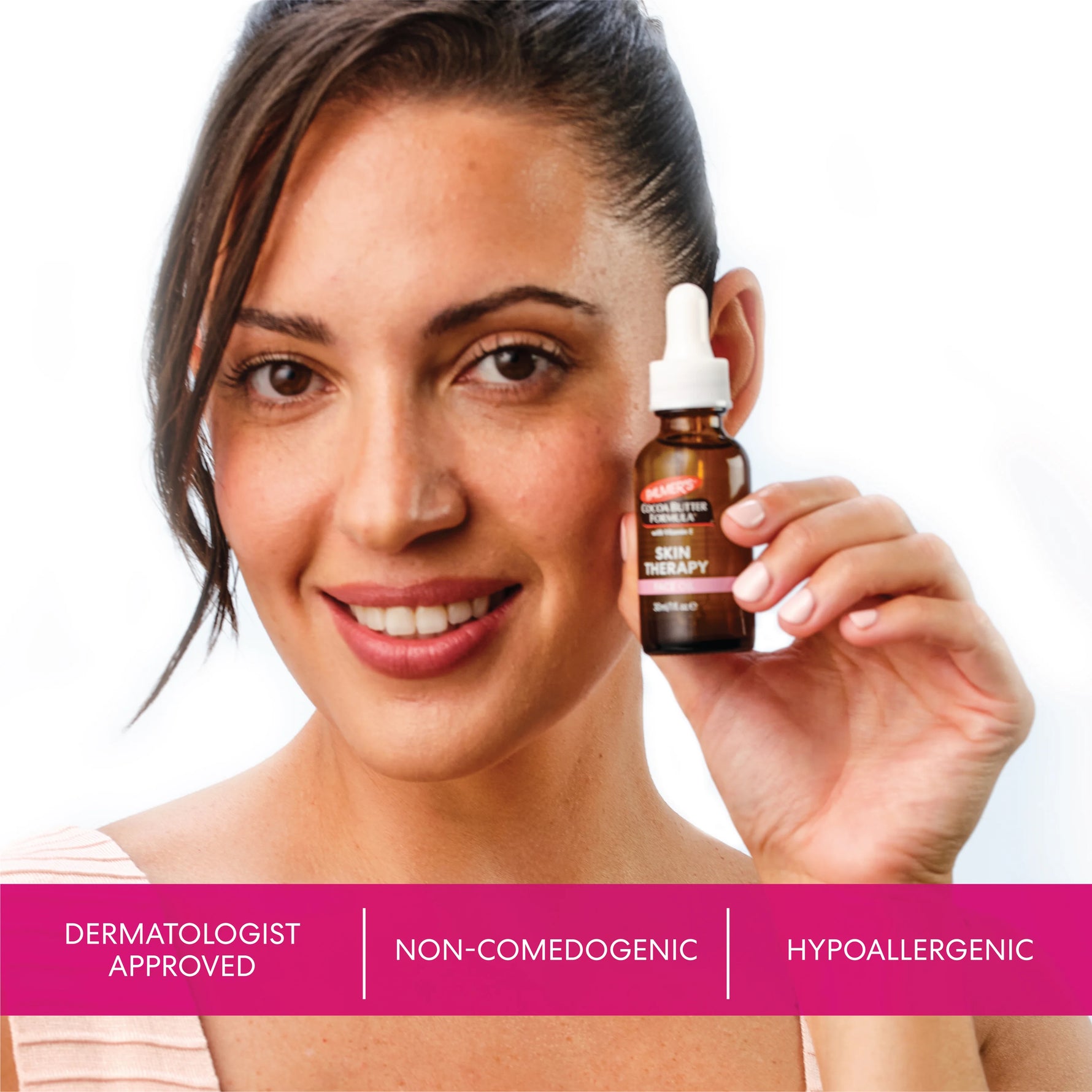 Woman holding a bottle of Palmer's Skin Therapy Face Oil with product features displayed below.