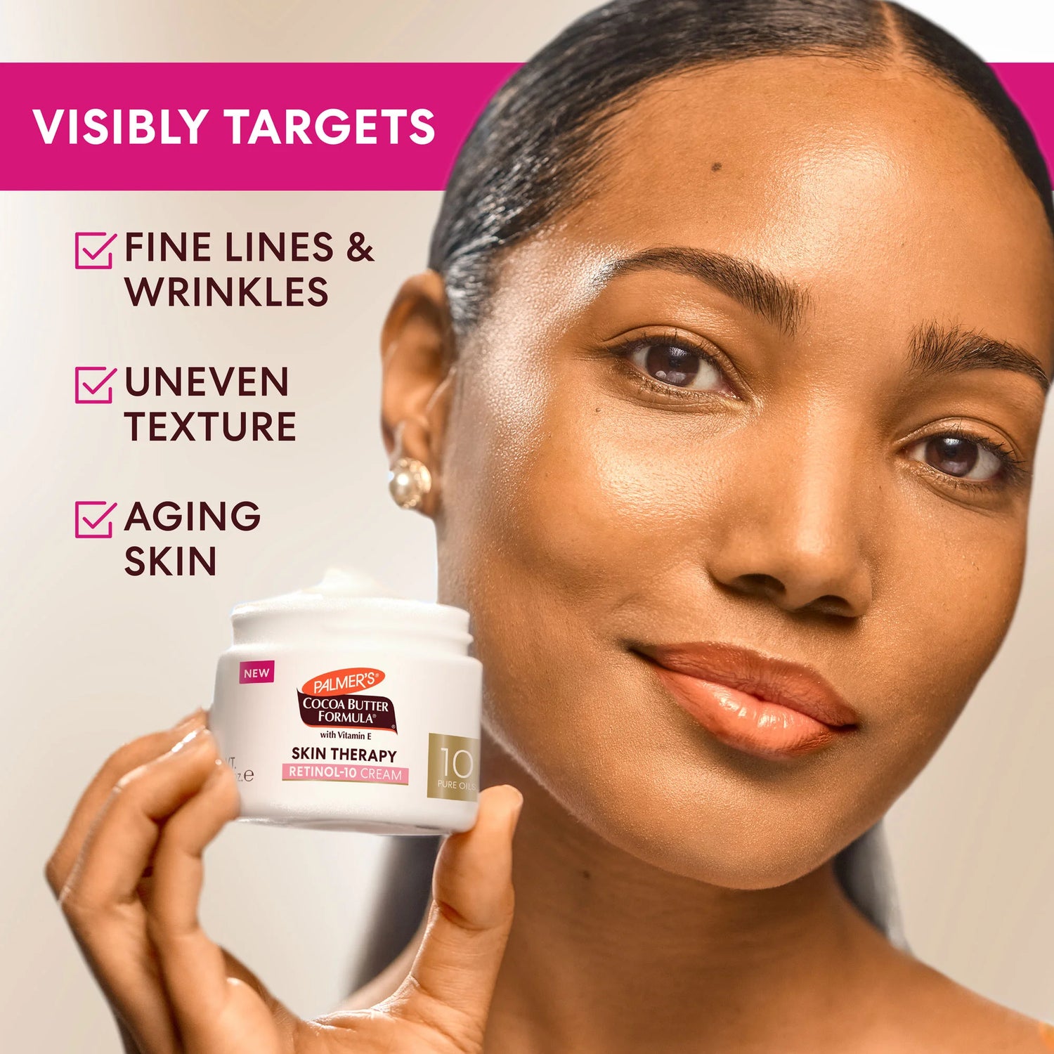 Woman holding a Palmer's Skin Therapy Retinol 10 Cream with text highlighting product benefits on a pink background