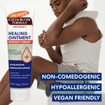 Palmer's Cocoa Butter Formula Healing Ointment with a person applying it to their arm.