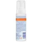 Back view of a skincare product bottle with text and labels on a white background